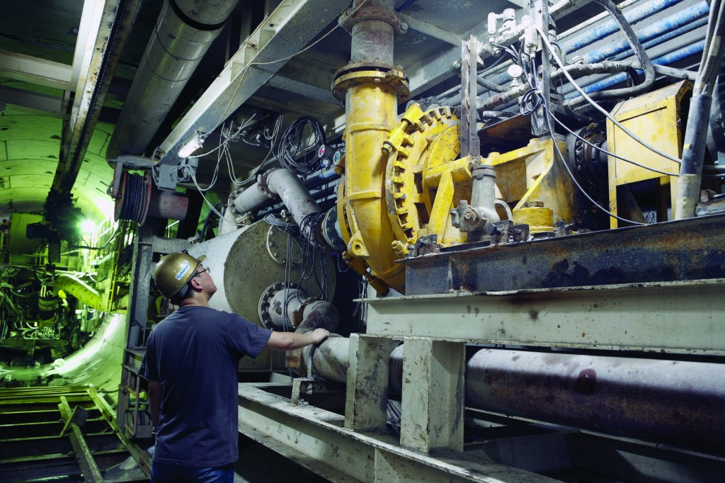 Robbins Project Manager David Han inspects the Slurry TBM, which achieved advance rates of up to 392 m (1,290 ft) per month