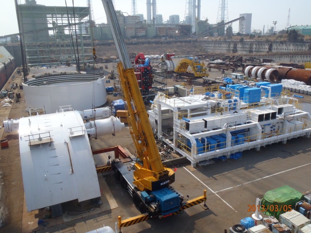 Pieces of Bertha, the SR 99 tunneling machine, wait to be loaded on a ship in Japan in March 2013. The machine will arrive in Seattle in late March or early April 2013, depending on weather. It will then be reassembled and launched beneath downtown Seattle from an 80-ft deep pit to the west of Seattle's stadiums. Tunneling is scheduled to start in summer 2013. (Photo from Washington State DOT)